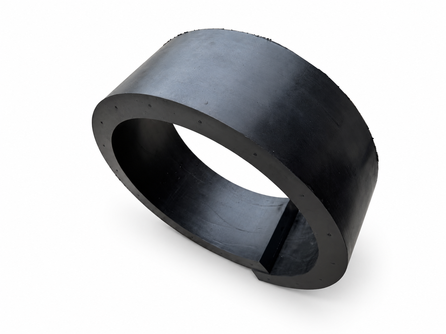 Large thick-walled black rubber circular component with an open center